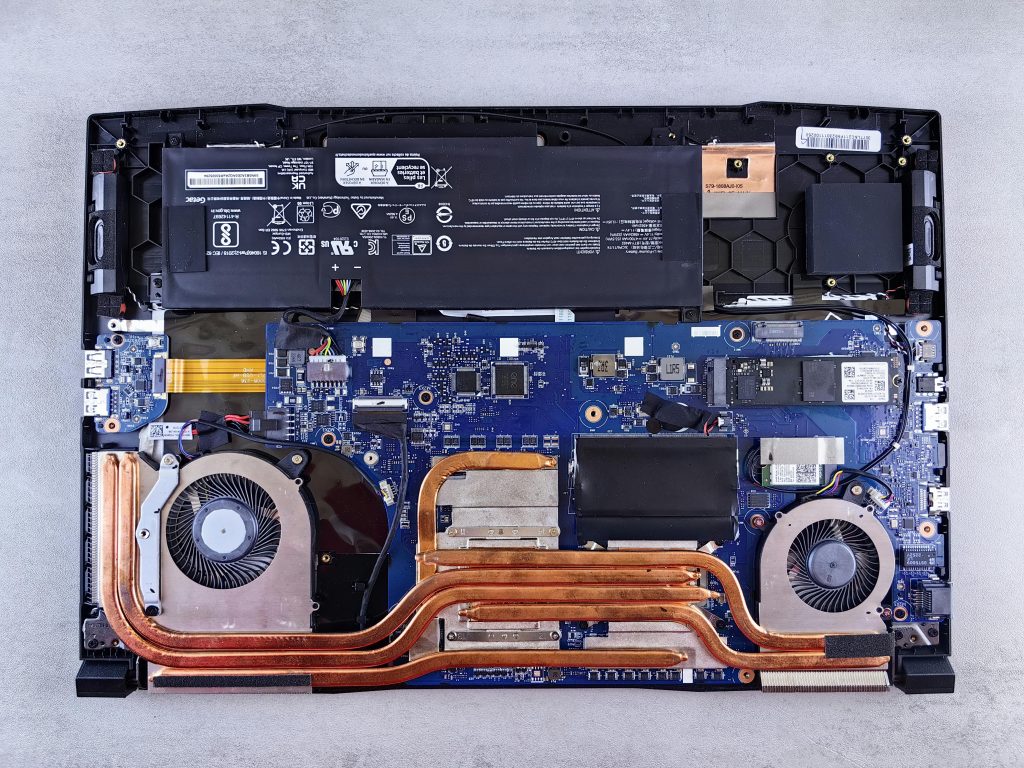 Detailed view of laptop motherboard and cooling system components.